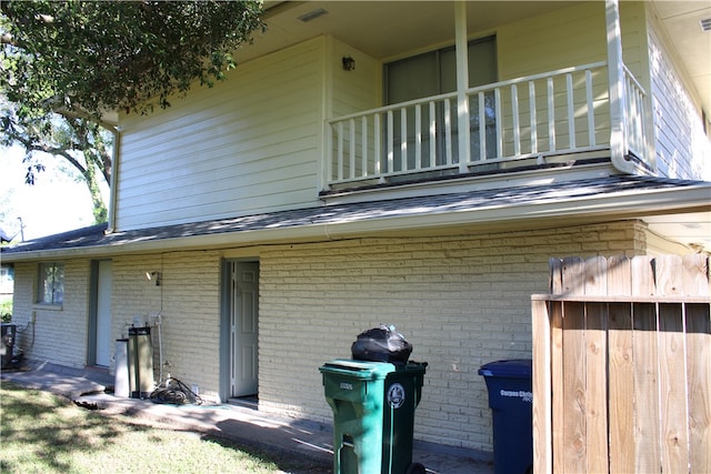 back of property with a balcony