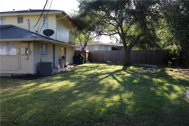 view of yard with central AC