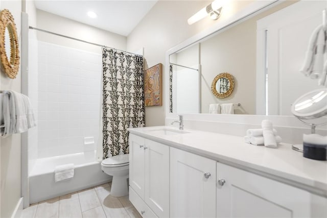 bathroom with toilet, shower / tub combo, vanity, and tile patterned floors