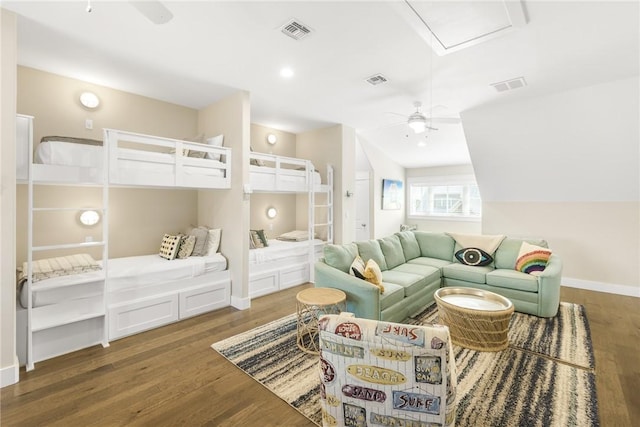 bedroom featuring dark wood-style floors, visible vents, and baseboards