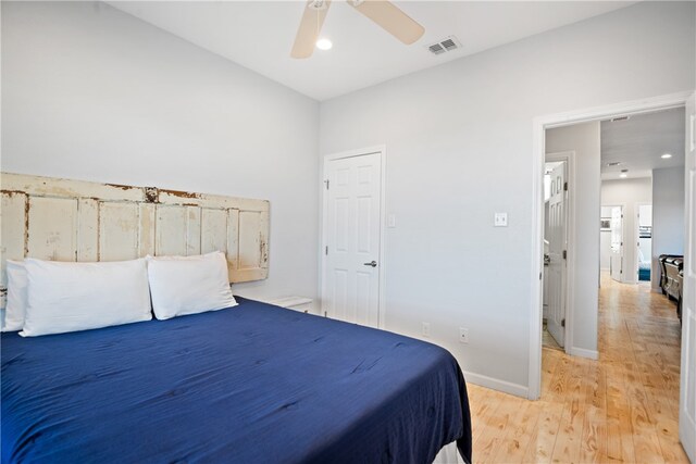 bedroom with light wood-type flooring and ceiling fan