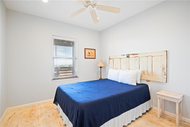 bedroom featuring ceiling fan and light wood-type flooring