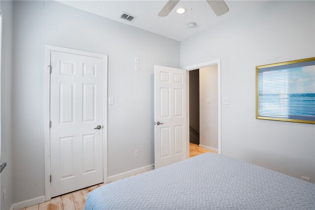 bedroom with ceiling fan and light hardwood / wood-style flooring