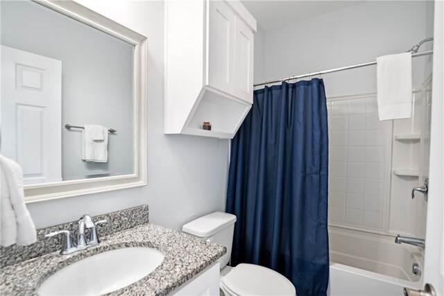 full bathroom featuring vanity, shower / bathtub combination with curtain, and toilet