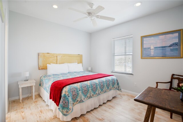 bedroom featuring hardwood / wood-style flooring and ceiling fan