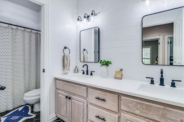 6046 Tarafaya Dr, Corpus Christi, TX 78414 - full bath with double vanity and tile patterned floors
