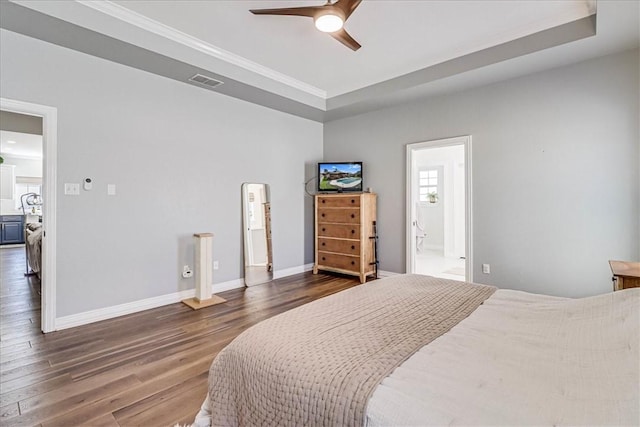 6046 Tarafaya Dr, Corpus Christi, TX 78414 - bedroom with dark wood-style floors, multiple windows, ornamental molding, ceiling fan, and ensuite bathroom