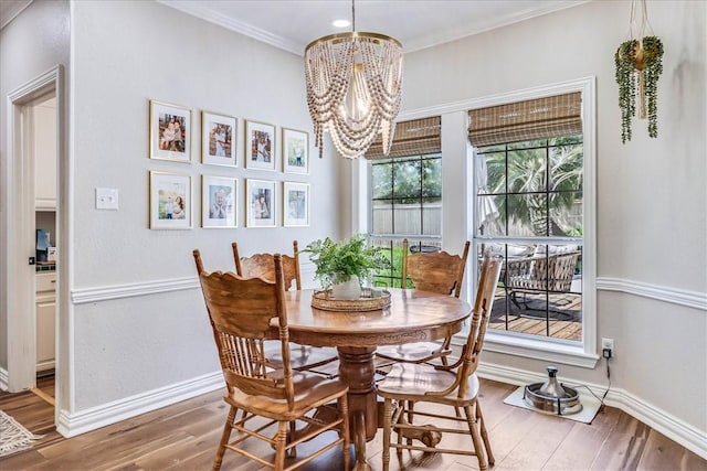 6046 Tarafaya Dr, Corpus Christi, TX 78414 - dining area with a chandelier, wood finished floors, and crown molding