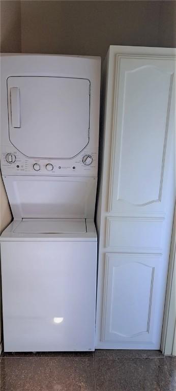 laundry room featuring stacked washer / dryer