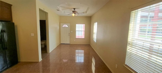 doorway to outside featuring ceiling fan