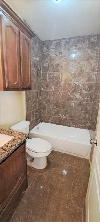 full bathroom with vanity, toilet, and tiled shower / bath