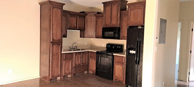 kitchen with tile patterned floors, electric panel, sink, and black appliances