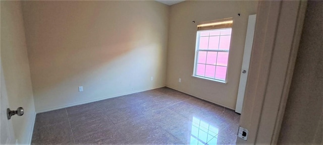 spare room featuring a wealth of natural light