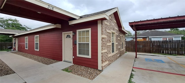 view of property exterior with a patio