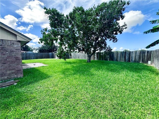 5406 Sugar Creek Dr, Corpus Christi, TX 78413 - fenced backyard featuring a patio area