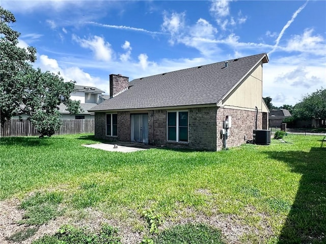 5406 Sugar Creek Dr, Corpus Christi, TX 78413 - rear view of property with a patio, brick siding, roof with shingles, and a chimney
