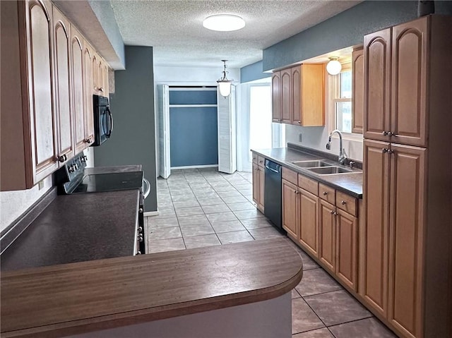 5406 Sugar Creek Dr, Corpus Christi, TX 78413 - kitchen featuring black appliances, a textured ceiling, dark countertops, decorative light fixtures, and light tile patterned floors