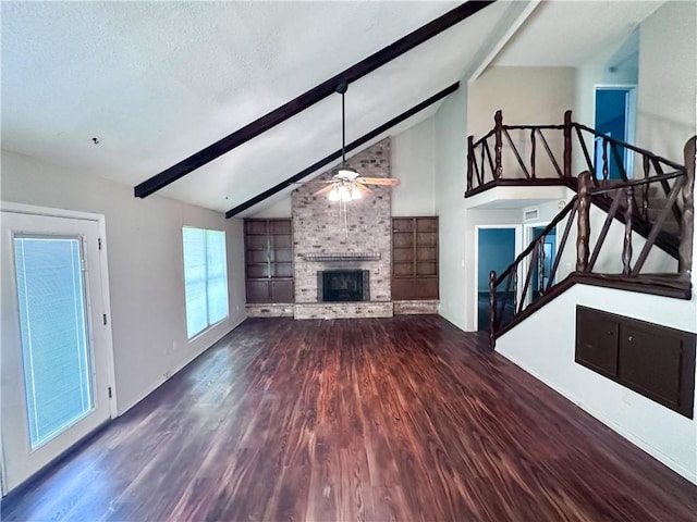 5406 Sugar Creek Dr, Corpus Christi, TX 78413 - unfurnished living room with a ceiling fan, wood finished floors, a fireplace, and stairs