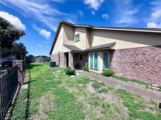 5406 Sugar Creek Dr, Corpus Christi, TX 78413 - back of house with brick siding and a fenced backyard
