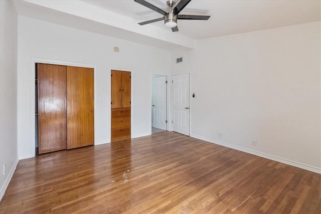 1009 Driftwood Pl, Corpus Christi, TX 78411 - unfurnished bedroom featuring wood finished floors, vaulted ceiling, and a ceiling fan