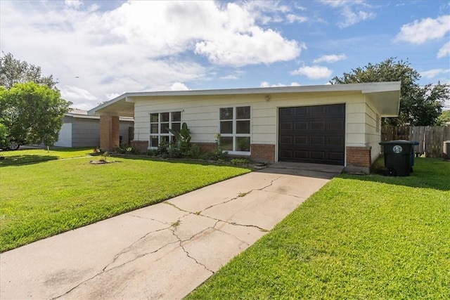 1009 Driftwood Pl, Corpus Christi, TX 78411 - view of front of home featuring brick siding, a garage, and driveway