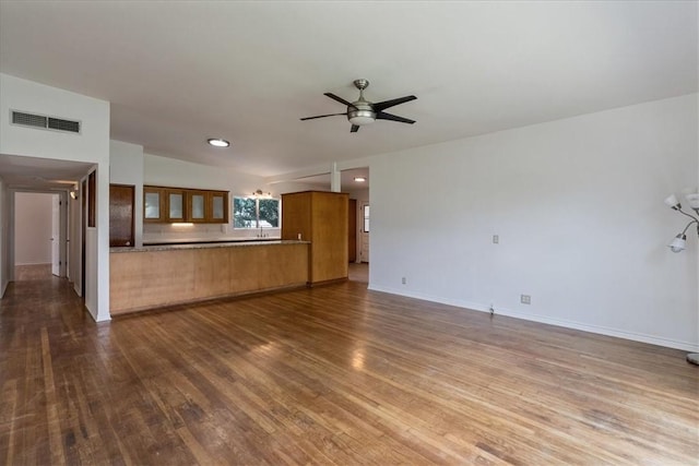 1009 Driftwood Pl, Corpus Christi, TX 78411 - unfurnished living room with dark wood finished floors and ceiling fan