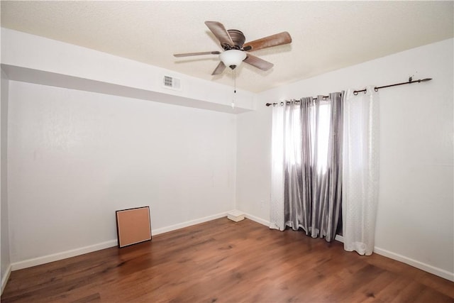 4410 Hebert, Corpus Christi, TX 78413 - spare room featuring visible vents, baseboards, ceiling fan, and wood finished floors