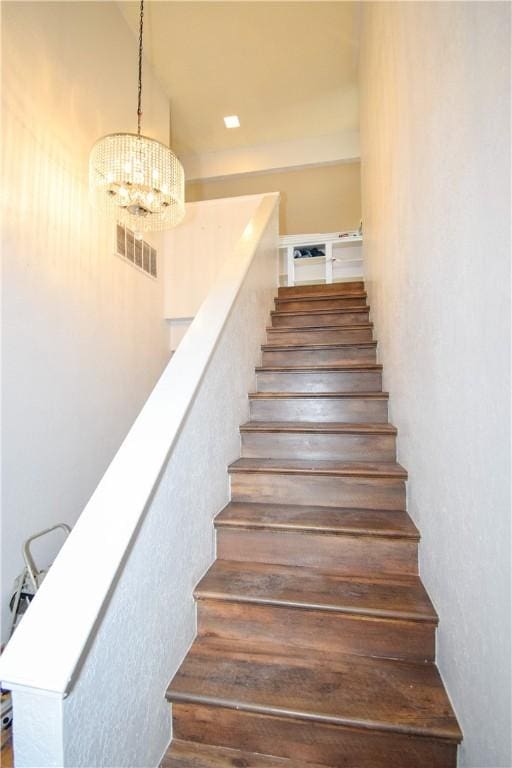 4410 Hebert, Corpus Christi, TX 78413 - stairs with visible vents and an inviting chandelier
