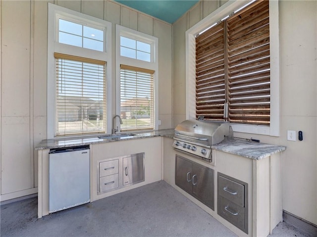 interior space featuring grilling area, area for grilling, and a sink