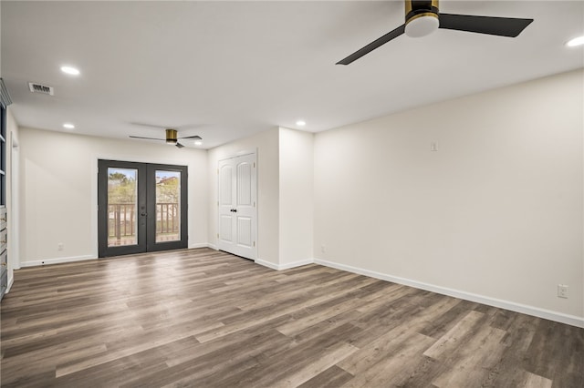 spare room featuring french doors, ceiling fan, and hardwood / wood-style floors