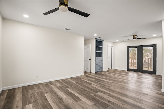 unfurnished living room with hardwood / wood-style flooring, french doors, and ceiling fan