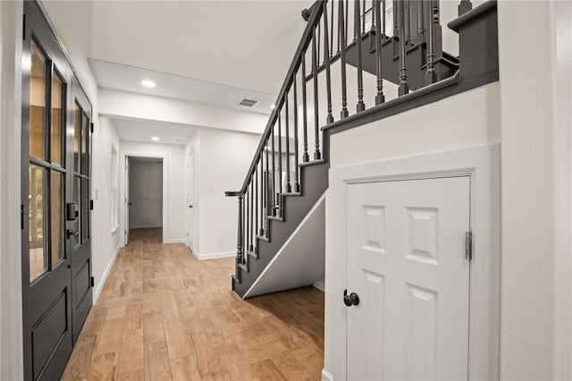 foyer with light hardwood / wood-style flooring