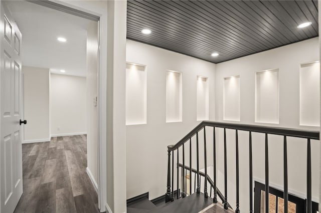 corridor featuring hardwood / wood-style floors and wood ceiling