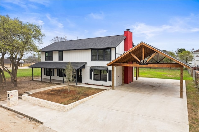 view of front of property with a carport and a porch