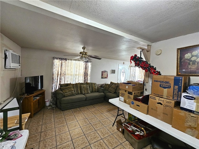 tiled living room with a textured ceiling, a wall unit AC, and ceiling fan