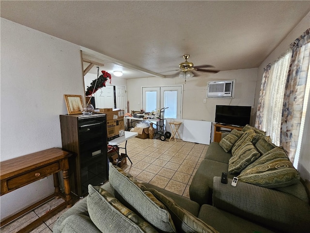 living room with ceiling fan, a textured ceiling, an AC wall unit, and french doors