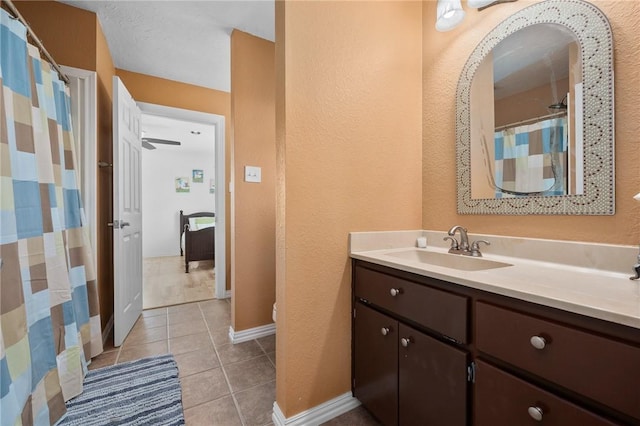 109 Tarpon Ct, Aransas Pass, TX 78336 - full bath featuring vanity, tile patterned flooring, a textured wall, toilet, and baseboards