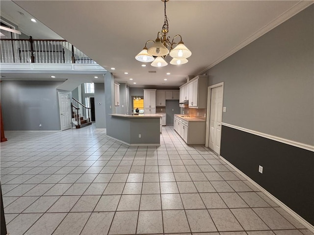 4513 Ammer Lake Dr, Corpus Christi, TX 78413 - kitchen featuring ornamental molding, a chandelier, open floor plan, light tile patterned floors, and hanging light fixtures