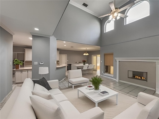 4513 Ammer Lake Dr, Corpus Christi, TX 78413 - living area featuring crown molding, a ceiling fan, a glass covered fireplace, and recessed lighting