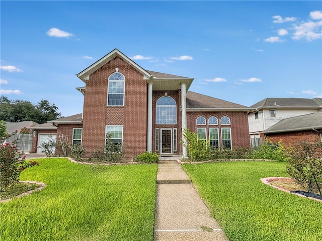 4513 Ammer Lake Dr, Corpus Christi, TX 78413 - view of front of property featuring brick siding, a front lawn, and a garage