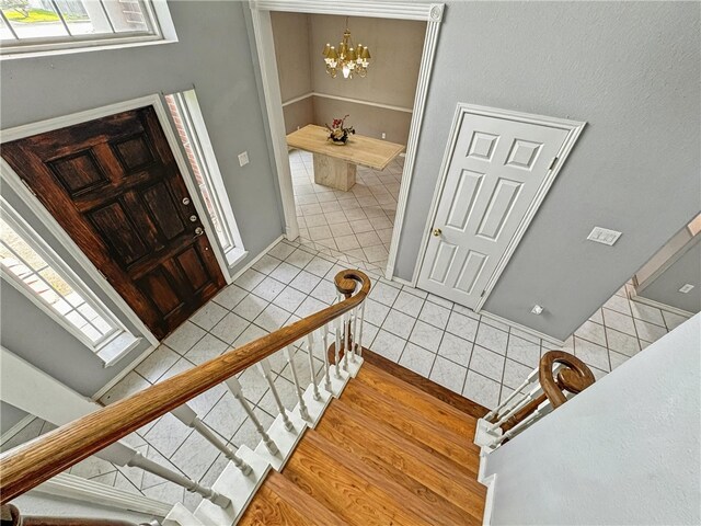 4513 Ammer Lake Dr, Corpus Christi, TX 78413 - stairway featuring tile patterned floors and a chandelier