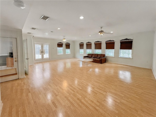 4513 Ammer Lake Dr, Corpus Christi, TX 78413 - unfurnished living room featuring healthy amount of natural light, light wood-style floors, a ceiling fan, and recessed lighting