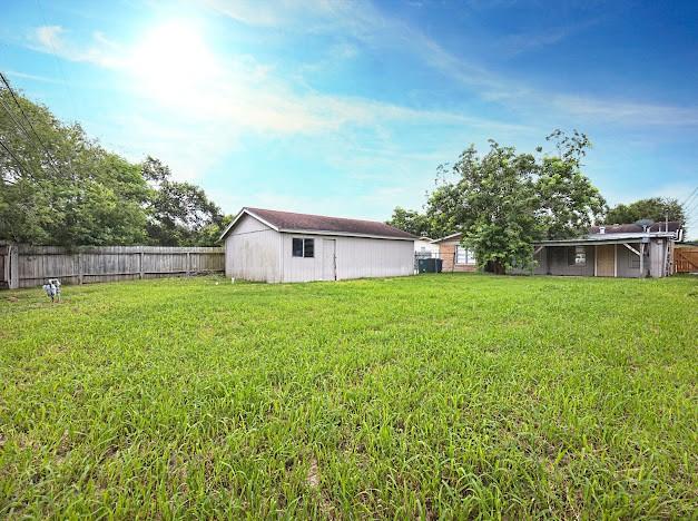6022 Norvel Dr, Corpus Christi, TX 78412 - fenced backyard with an outbuilding