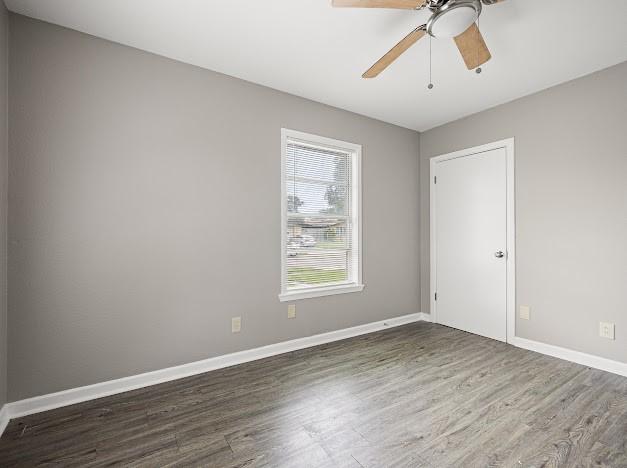 6022 Norvel Dr, Corpus Christi, TX 78412 - empty room with wood finished floors and ceiling fan