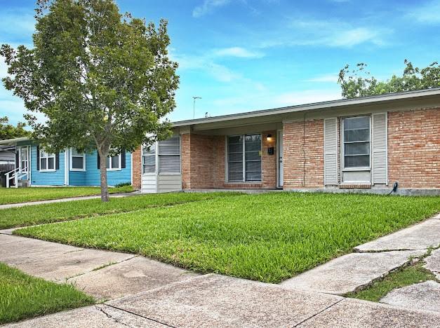 6022 Norvel Dr, Corpus Christi, TX 78412 - ranch-style home with a front lawn and brick siding
