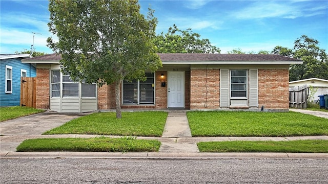 6022 Norvel Dr, Corpus Christi, TX 78412 - ranch-style home featuring a front lawn and brick siding