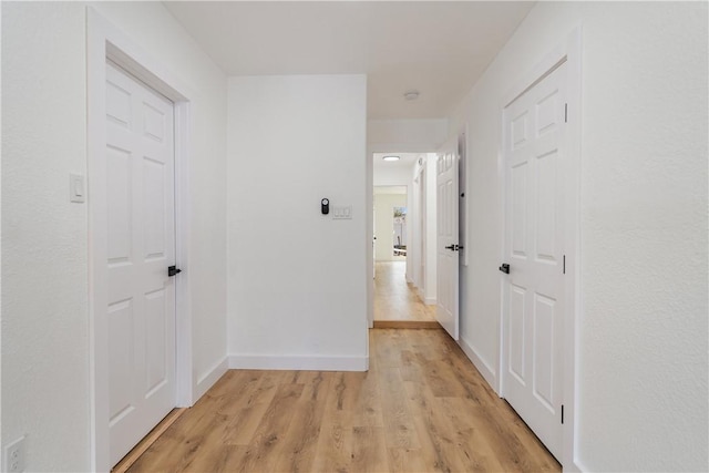 2442 Bevecrest Dr, Corpus Christi, TX 78415 - corridor featuring baseboards and light wood finished floors