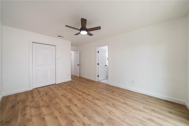 2442 Bevecrest Dr, Corpus Christi, TX 78415 - unfurnished bedroom with a closet, visible vents, baseboards, a ceiling fan, and light wood-type flooring