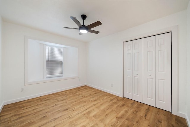 2442 Bevecrest Dr, Corpus Christi, TX 78415 - unfurnished bedroom with baseboards, a closet, light wood-style floors, and a ceiling fan