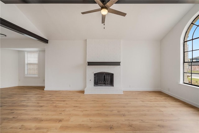 2442 Bevecrest Dr, Corpus Christi, TX 78415 - unfurnished living room with light wood-style flooring, baseboards, a fireplace, a ceiling fan, and vaulted ceiling